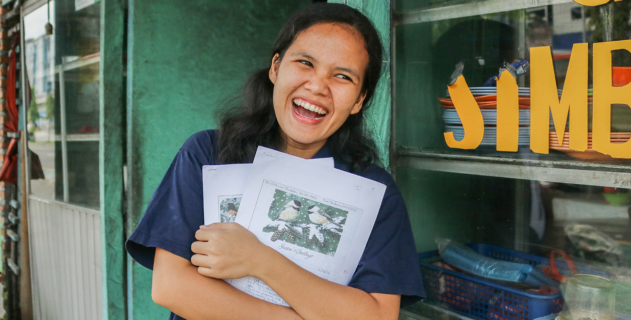 Ani holding her letters from her sponsor